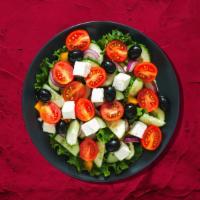 Great Greek Salad · Romaine lettuce, topped with tomatoes, onions, cucumber, and our fresh pita chips, and sumac...
