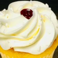 Torte Cupcake (Lemon Raspberry) · Lemon batter filled with raspberry fruit, topped with lemon mousse, garnished with white jim...