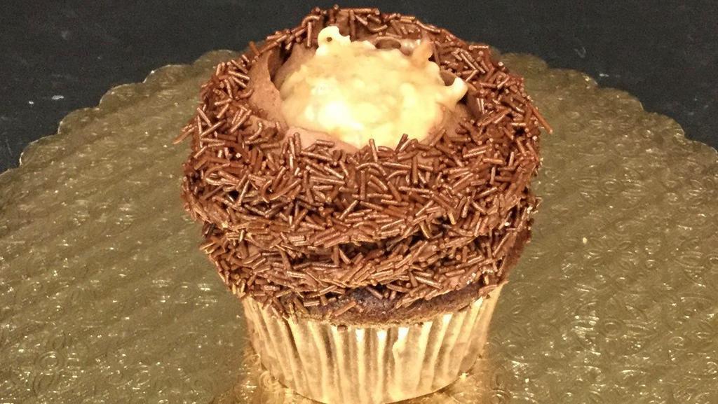German Chocolate · Three layers of chocolate cake, filled and topped with traditional pecan and coconut icing.  Cake is iced in our standard chocolate buttercream and chocolate sprinkles.
**Refrigeration is required**