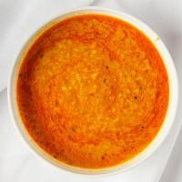 Daal Fry · Curried yellow split pea soup flavored with ginger, chili pepper, tomatoes, cumin, and garlic.