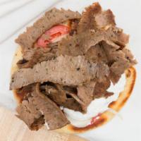 Gyro Sandwich · served on toasted pita bread and topped with gyro sauce, onion and tomato.