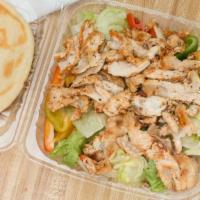 Chicken Salade · Garden Salad topped with green bell peppers, tomato, Marinated Grilled Chicken breast and pi...