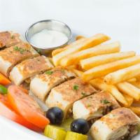 Chicken Shawarma Garden · Own style wrap comes with pickles and garlic sauce cut into pieces with a side of veggies, c...