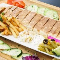 Steak Shawarma Garden · Own style wrap comes with tomatoes onions and tahini cut into pieces with a side of veggies,...