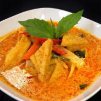 L- Red Curry · Your choice of meat with eggplant, bamboo, red bell peppers, and basil simmered in red curry...