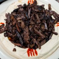 Hummus & Meat · A creamy classic topped with meat and served with pita bread.