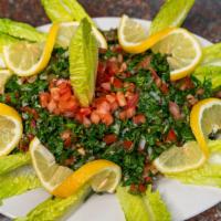Tabbouli Salad · Parsley mixed with diced tomato, green onion, burghul wheat, and tossed in traditional love ...