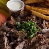 Meat Shawarma Plate · Our Meat Shawarma Is Made From Lamb Tenderloin Meat Served with tahini sauce and grilled veg...