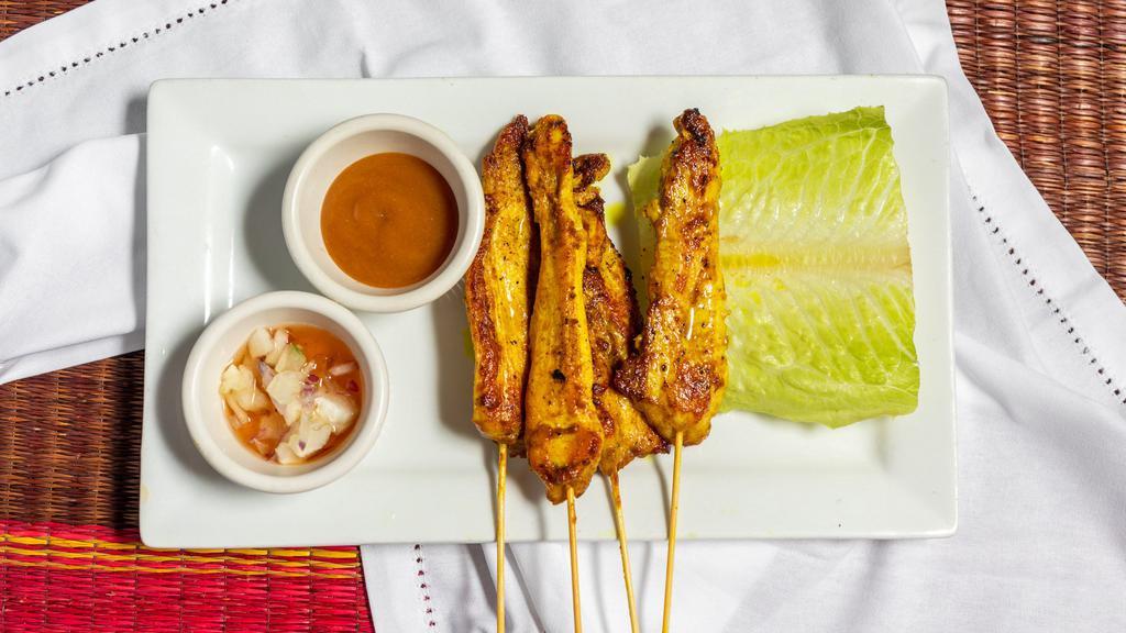 #2. Beef Or Chicken Satay · Tender beef or chicken marinated in coconut milk, curry, and other spices served with both Thai peanut sauce and cucumber sauce.