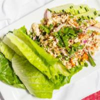 #14. Larb · Your choice of ground beef or chicken with lemon juice, chili, green onions, and crushed toa...