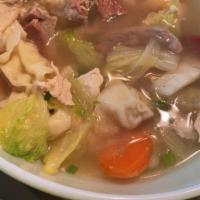 #18. Wonton Soup · Clear broth, egg noodle soup, topped with slices of roast pork, and vegetables.