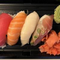 Nigiri Appetizer · 5 pieces of chef's selection of assorted raw fish over white rice with a side of ginger and ...