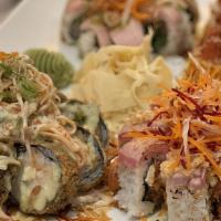 Miyagi Roll · Tuna, salmon, escolar, scallions, cream cheese, yuzu tobiko topped with spicy tuna, spicy te...