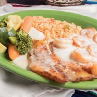 Pescado Con Camarones · Signature item. Tilapia fillet and shrimp seasoned and grilled, covered with white cheese sa...
