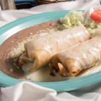 Chimichangas · Two chimichangas with your choice of meat covered with white cheese sauce and served with be...