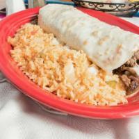 Burrito Fajitas · Flour tortilla stuffed with your choice of meat, grilled onions, bell peppers and tomatoes, ...