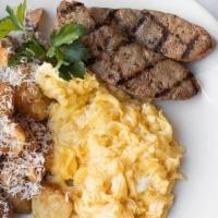 Prossimo Breakfast · three eggs any style, truffled fried potatoes, toast with jam, and grilled slab bacon