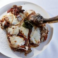 Veal Chop Parmigiana · Bone-in veal chop lightly breaded and fried. Topped with marinara and toasted mozzarella. Se...