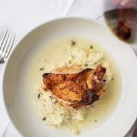 Frascati Chicken · Two pan-seared chicken breasts poached in a parmesan broth. Served with vegetables sauteed i...