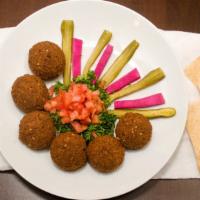Falafel · Lightly fried patties made from chickpeas, herbs, fresh garlic, and house spices served with...