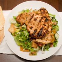 Grilled Chicken Fattoush · Grilled chicken rolled with fattoush salad and garlic sauce.
