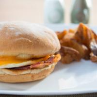 Breakfast Sandwich · 1 over easy Gast farm egg, cheddar or American cheese, chile mayo, on a toasted potato roll....