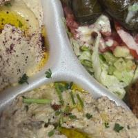 Large Sampler Appetizer · Sampler appetizers includes: 3 pieces of falafel, 6 stuffed grape leaves, hummus, and baba g...
