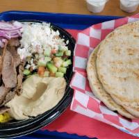 Gyro Platter · Our gyro served on rice with hummas and salad mix. Topped with tzatziki (cucumber) sauce and...