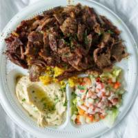 Beef Shawarma Platter · Succulent layers of lamb & beef, served with rice,  with Hummus and Jerusalem salad