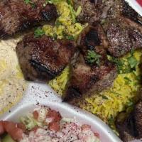 Beef Kabab Platter · Two skewers of beef marinated in our own special recipe. Served with rice, HUMMAS and salad ...