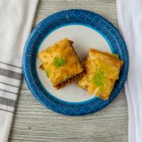 Baklava · A rich, sweet pastry made of layers of filo pastry filled with chopped nuts and sweetened wi...