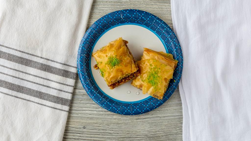 Baklava · A rich, sweet pastry made of layers of filo pastry filled with chopped nuts and sweetened with honey.