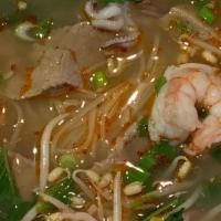 Pho Noodle · Rice noodles in a savory broth topped with chopped cilantro and green onion. Served with a s...