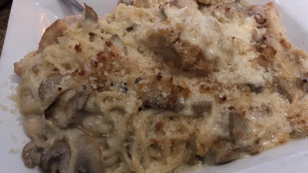 Pollo Aldo · Strips of chicken sautéed with mushrooms, tossed with capellini and our creamy alfredo sauce; topped with toasted bread crumbs.