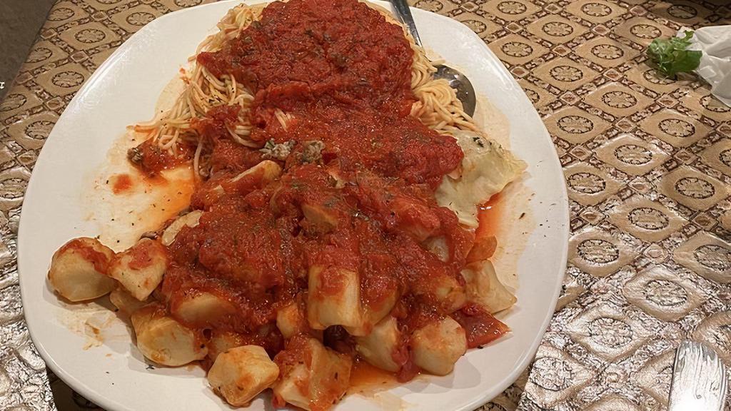 Pasta Trio · Veal or cheese ravioli, gnocchi, and capellini topped with mamma's tomato sauce.