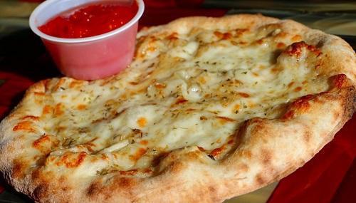 Garlic Cheese Bread · Olive oil, Parmesan, fresh sliced garlic, oregano, mozzarella with a side of crushed tomato sauce