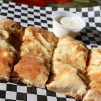 Stuffed Cheese Bread · Mozzarella and Parmesan stuffed into our signature crust and wood fired. Made with or withou...