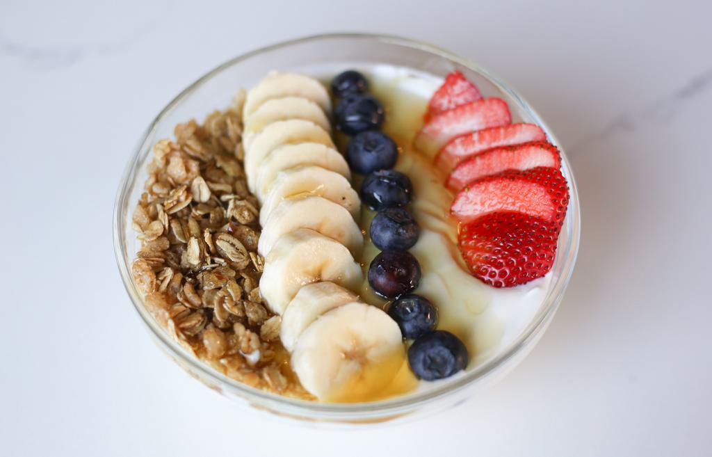 Parfait · plain greek yogurt topped with granola, banana, 
blueberries, strawberries & honey drizzle