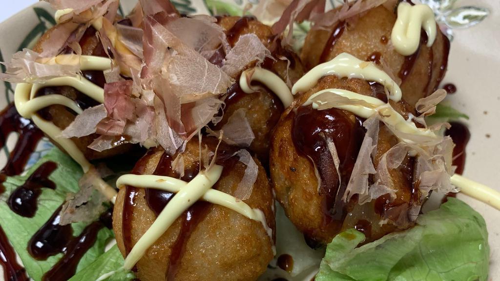 Takoyaki · Fried Japanese octopus balls, kewpie mayo, sweet sauce, bonito flakes, nori shredded.
