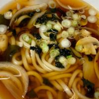 Udon Noodle Soup · Soy dashi broth, mushroom, onion, green onion, egg, seaweed.