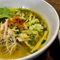 Soto Ayam · Yellow chicken soup with vermicelli, hard-boiled egg, bean-sprout and lemon.