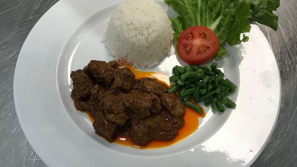 Beef Rendang · Slow and longer cooked beef in coconut milk with rendang spices. Served with fried egg and vegetable of the day.