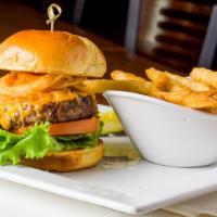 Black Label Burger · Sharp cheddar cheese, fried onions, zesty sauce, lettuce, and tomatoes.