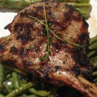 Tomahawk Pork Chop · Bone-in pork chop, rubbed in a blend of seasonings and  chargrilled to perfection.