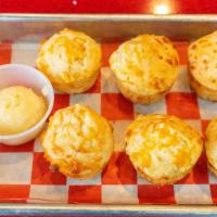 Cheddar Biscuit Basket · Six cheddar cheese biscuits with honey butter.