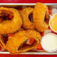 Onion Rings · Thick cut, hand-breaded, double-dredged with buttermilk ranch and comeback sauce.