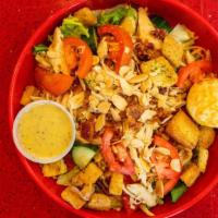 Chicken Scratch Salad · Fresh garden greens, choice of fried or rotisserie chicken, tomatoes, cucumbers, chopped bac...