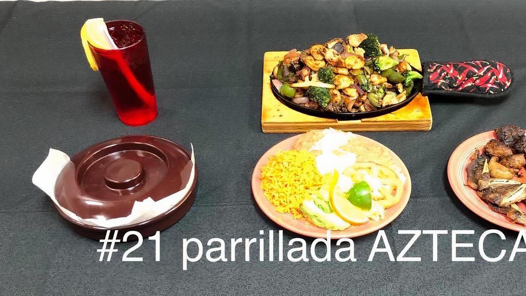 # 21 Parillada Azteca  · la parilladas de carne de rez,pollo,chorizo,cmarones y costillas  de rez incluyen chile morron tomate,brocoly,hongos(opcional) y servido con arroz,frijoles,ensalada y  12 tortillas.
the grilled meat, chicken, chorizo, shrimp and ribs include bell pepper tomato, broccoli, mushrooms (optional) and served with rice, beans, salad and 12 tortillas.