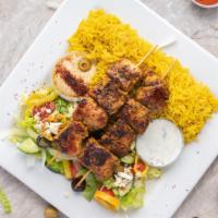 Chicken Kabob Platter · Tender chicken kabob served with generous basmati rice, greek salad, pita bread, side hummus...
