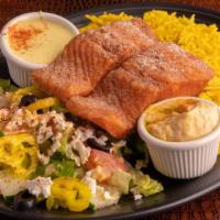 Salmon Platter · Breaded pan-fried Salmon with serving of rice , greek salad, pita bread, side hummus, and ta...